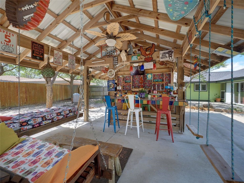 202 Sunset Ingleside, TX 78362 - Photo 33 of 40 a view of a chairs and tables in patio