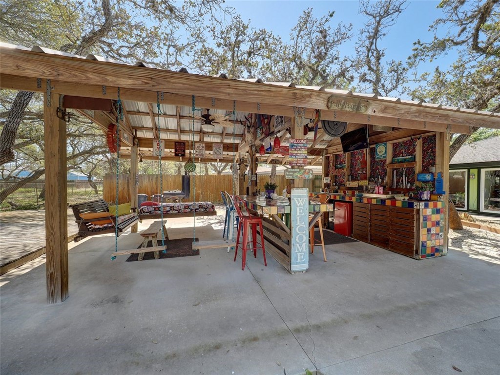 202 Sunset Ingleside, TX 78362 - Photo 35 of 40 a view of a patio with dining table and chairs