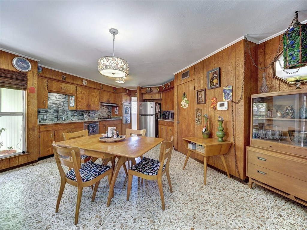 202 Sunset Ingleside, TX 78362 - Photo 5 of 40 a view of a dining room with furniture window and outside view