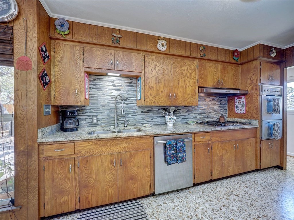 202 Sunset Ingleside, TX 78362 - Photo 6 of 40 a bathroom with a granite countertop sink a mirror and shower