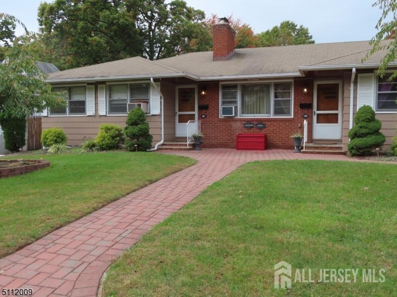 a view of a house with a yard porch and sitting area