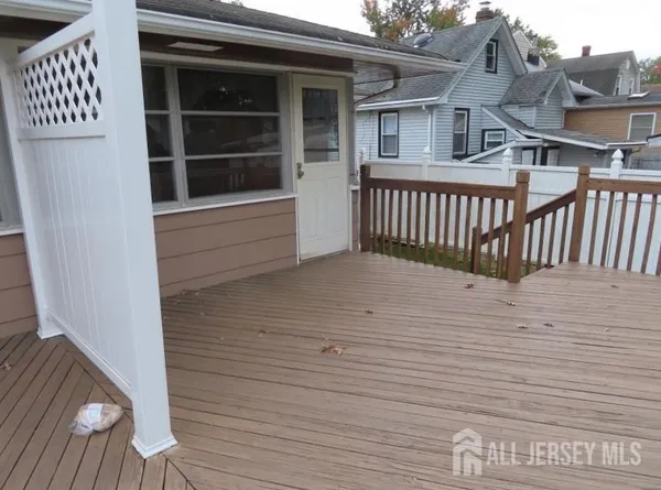 a view of a house with wooden deck