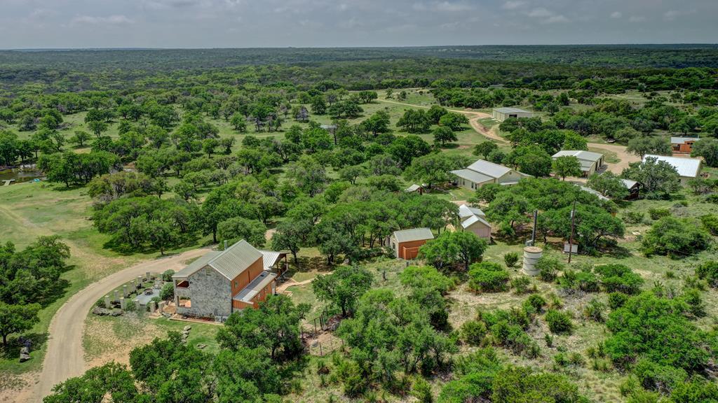 820 Bobby Shelton Ranch Road Northwest Mountain Home, TX 78058 - Photo 1 of 85 an aerial view of a house with a yard