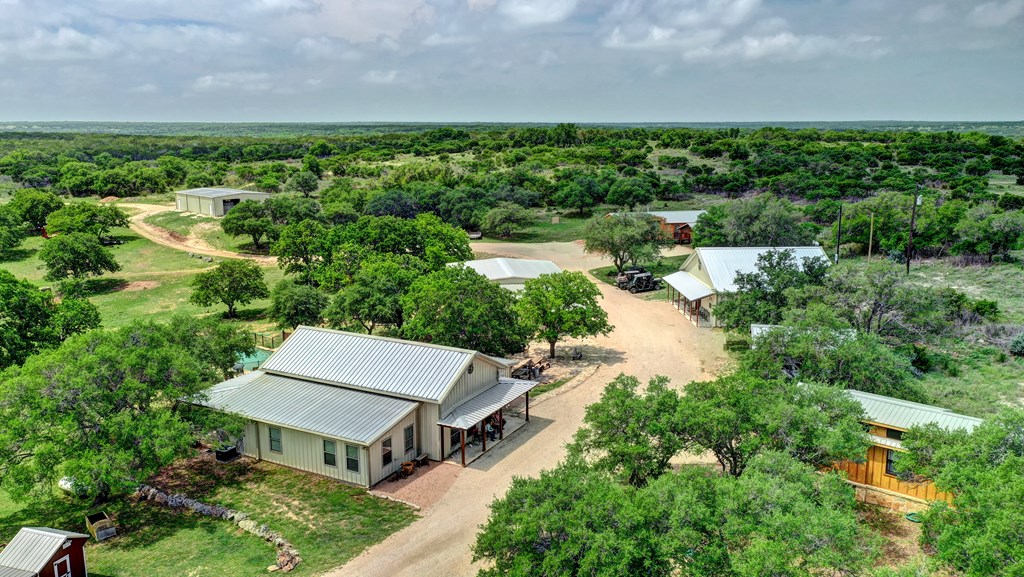 820 Bobby Shelton Ranch Road Northwest Mountain Home, TX 78058 - Photo 11 of 85 an aerial view of a house with a garden and lake view
