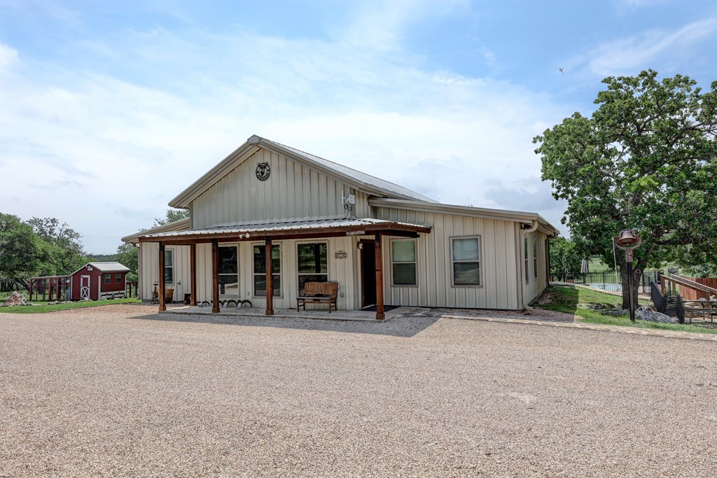 820 Bobby Shelton Ranch Road Northwest Mountain Home, TX 78058 - Photo 13 of 85 front view of a house with a porch