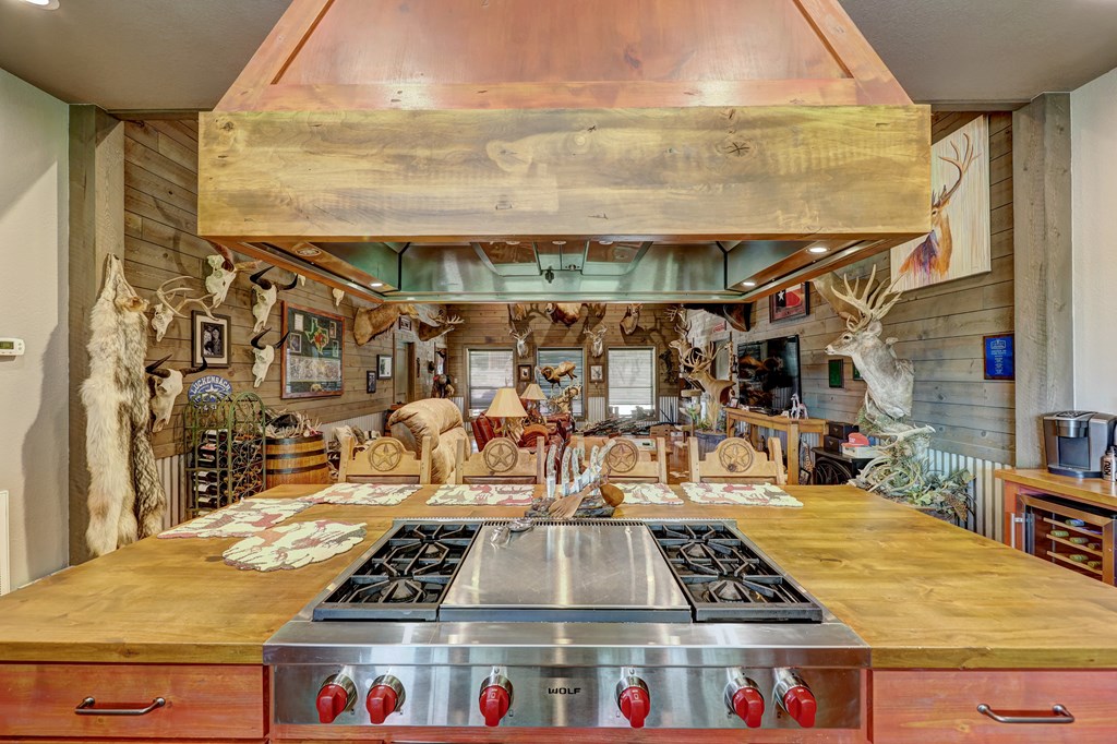820 Bobby Shelton Ranch Road Northwest Mountain Home, TX 78058 - Photo 17 of 85 a with a table and chairs in front of building