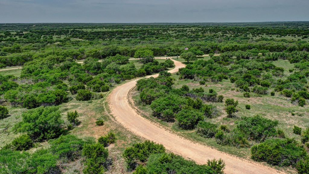820 Bobby Shelton Ranch Road Northwest Mountain Home, TX 78058 - Photo 22 of 85 an aerial view of a house with a yard