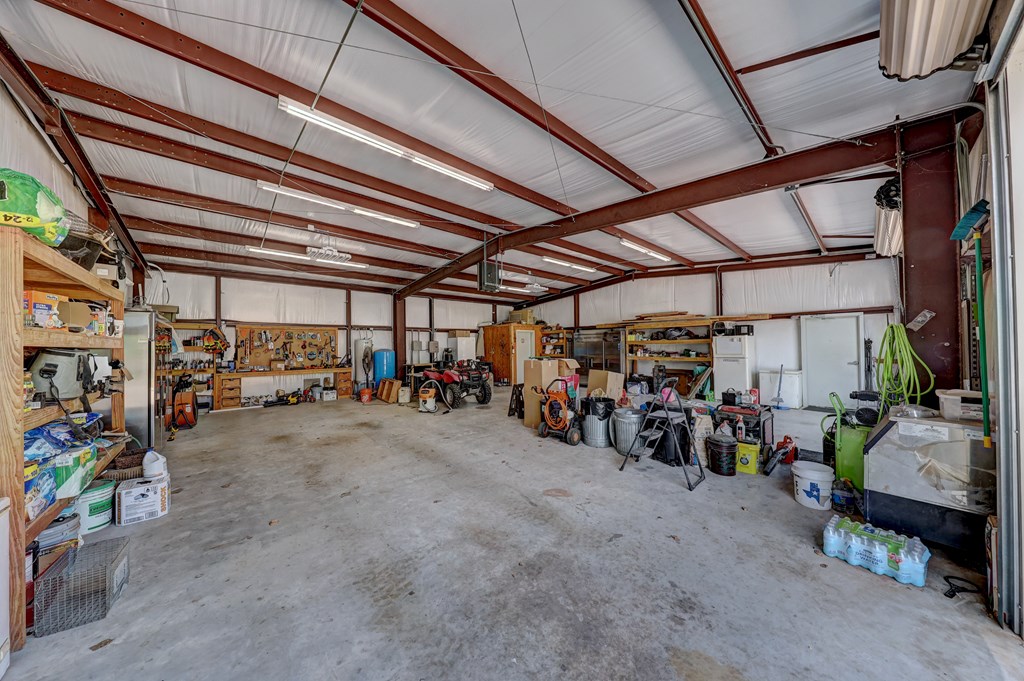 820 Bobby Shelton Ranch Road Northwest Mountain Home, TX 78058 - Photo 35 of 85 a view of a storage room with bicycles
