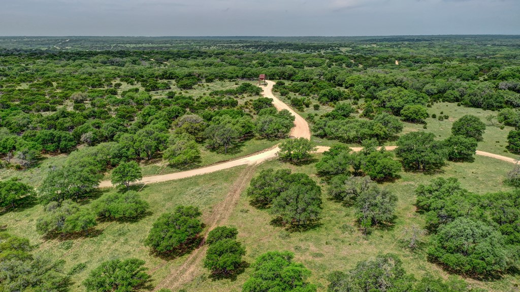 820 Bobby Shelton Ranch Road Northwest Mountain Home, TX 78058 - Photo 36 of 85 an aerial view of residential house with outdoor space