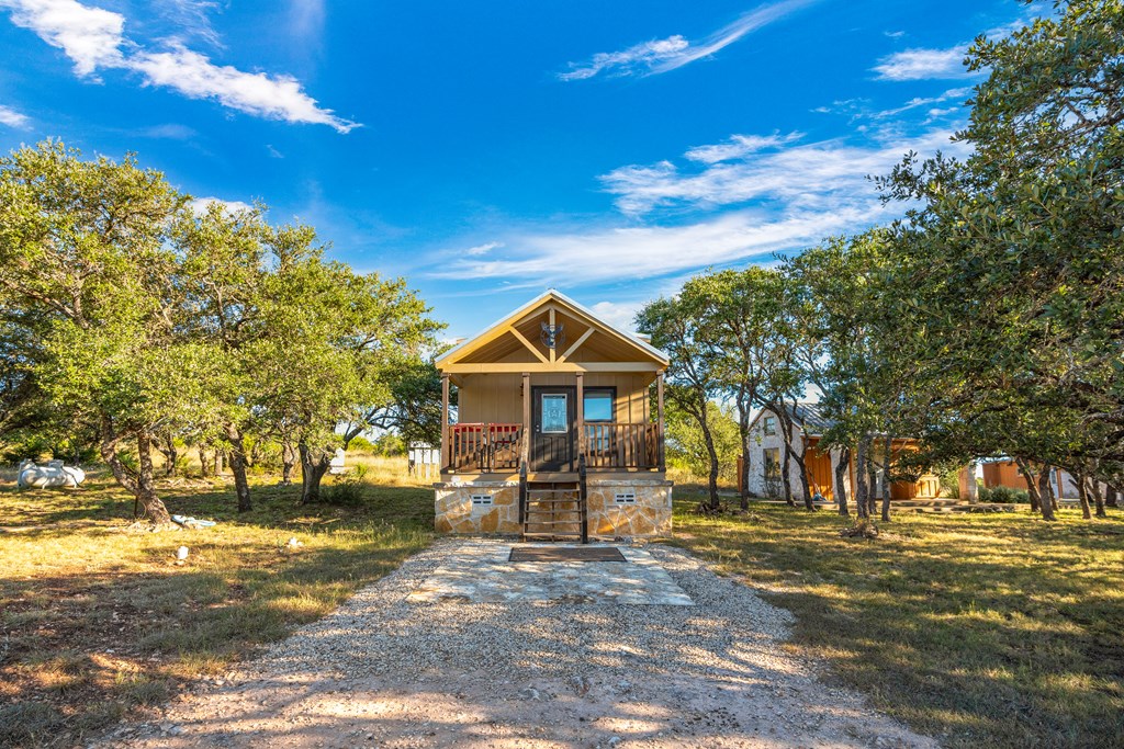 820 Bobby Shelton Ranch Road Northwest Mountain Home, TX 78058 - Photo 66 of 85 a front view of a house with a yard