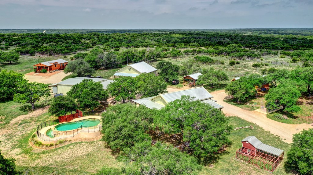 820 Bobby Shelton Ranch Road Northwest Mountain Home, TX 78058 - Photo 70 of 85 an aerial view of a house with a yard and lake view