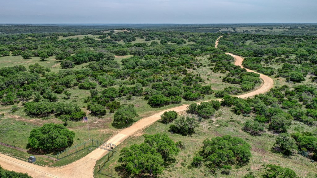 820 Bobby Shelton Ranch Road Northwest Mountain Home, TX 78058 - Photo 74 of 85 an aerial view of a residential houses with outdoor space and trees all around