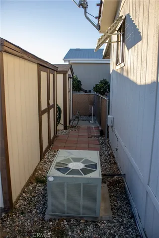 a view of a house with a small backyard