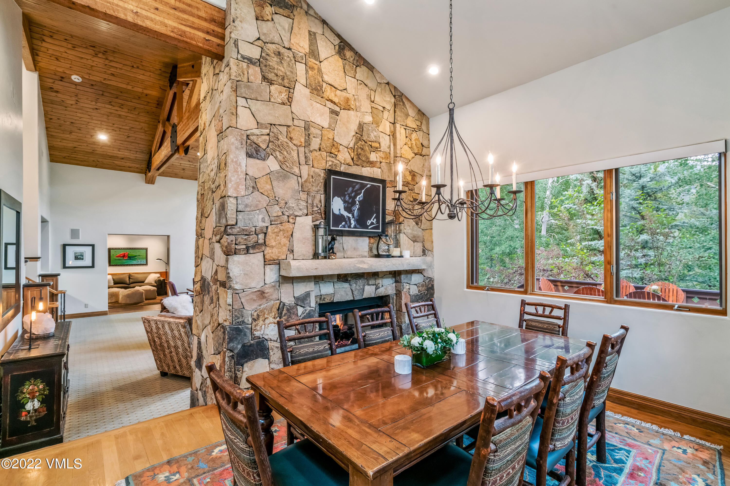 355 Forest Road, Unit B Vail, CO 81657 - Photo 11 of 36 a view of a dining room with furniture window and outside view