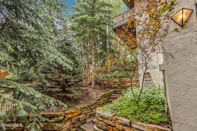 a backyard of a building with trees