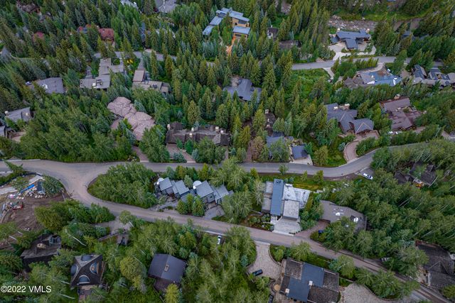 an aerial view of residential house with outdoor space and swimming pool