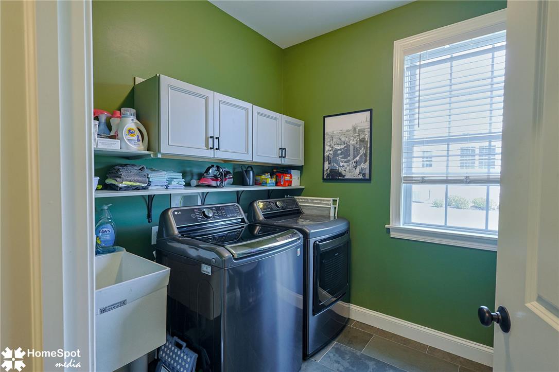 4518 Old Saucon Road Bethlehem, PA 18015 - Photo 8 of 19 A dedicated utility room boasts ample storage and modern laundry appliances, streamlining household chores.
