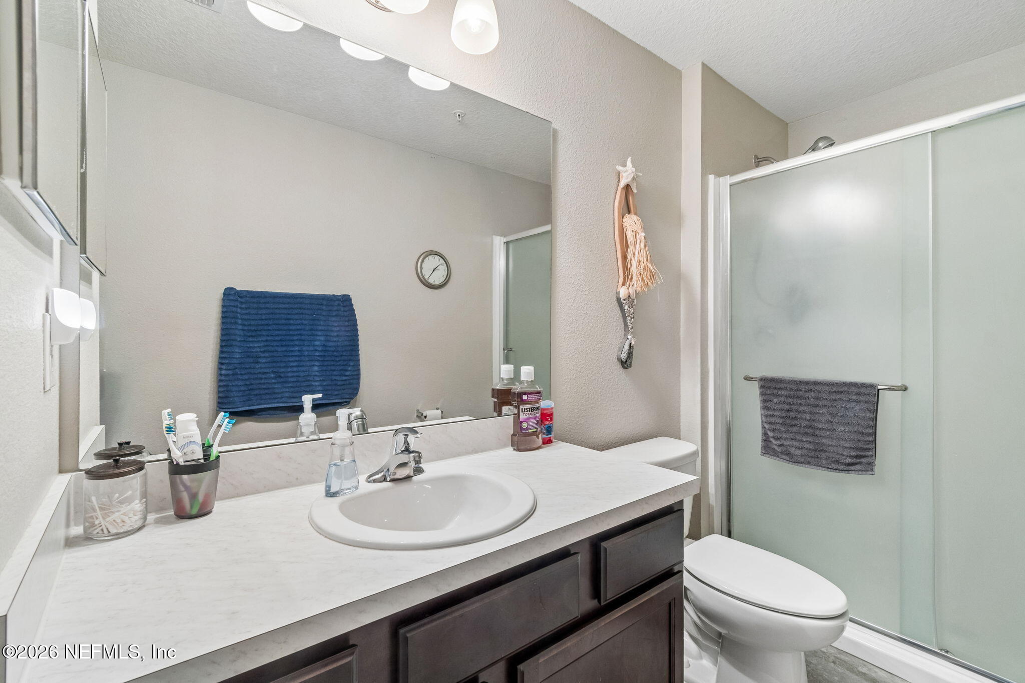 2113 Golden Lake Loop St. Augustine, FL 32084 - Photo 37 of 50 a bathroom with a sink toilet vanity and shower