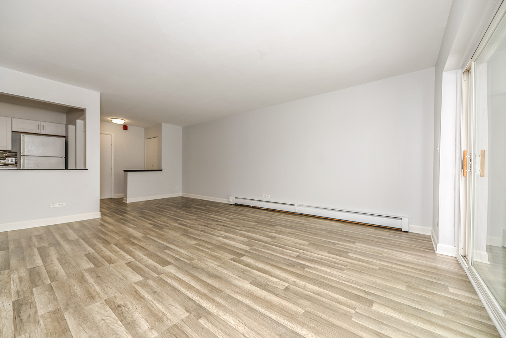 2234 South Goebbert Road, Unit 320 Arlington Heights, IL 60005 - Photo 11 of 37 wooden floor in an empty room