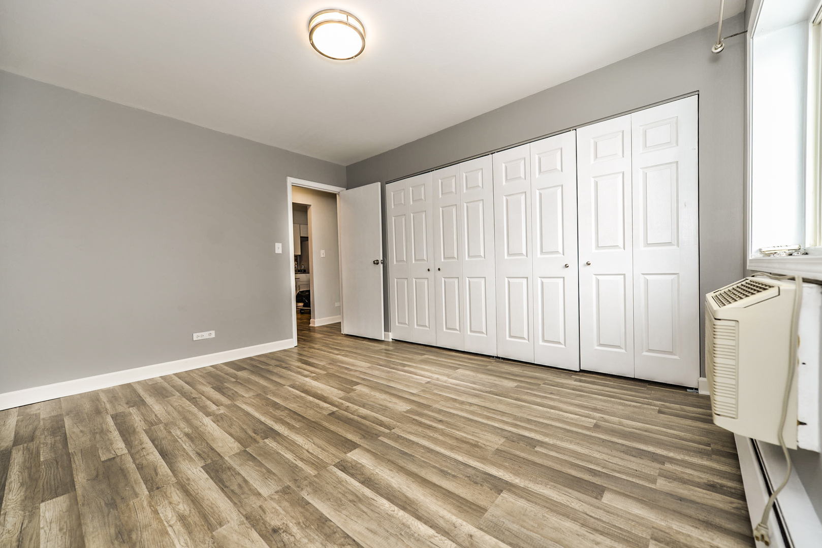 2234 South Goebbert Road, Unit 320 Arlington Heights, IL 60005 - Photo 22 of 37 a view of a livingroom with wooden floor