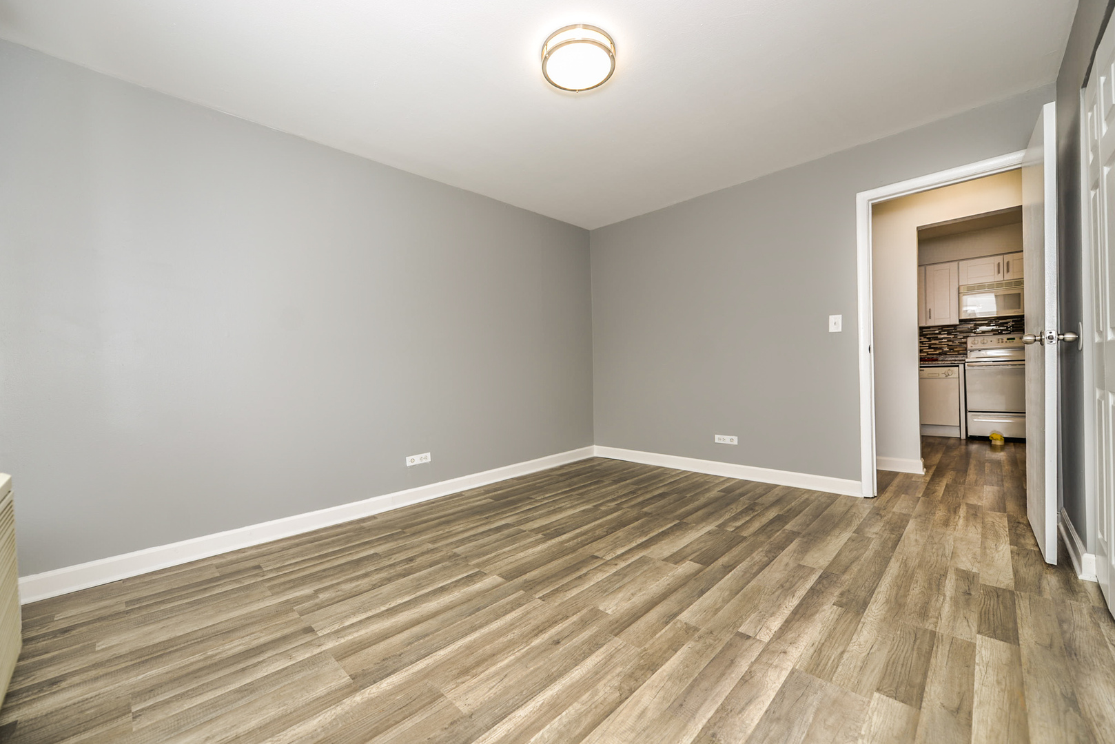 2234 South Goebbert Road, Unit 320 Arlington Heights, IL 60005 - Photo 23 of 37 wooden floor in a room