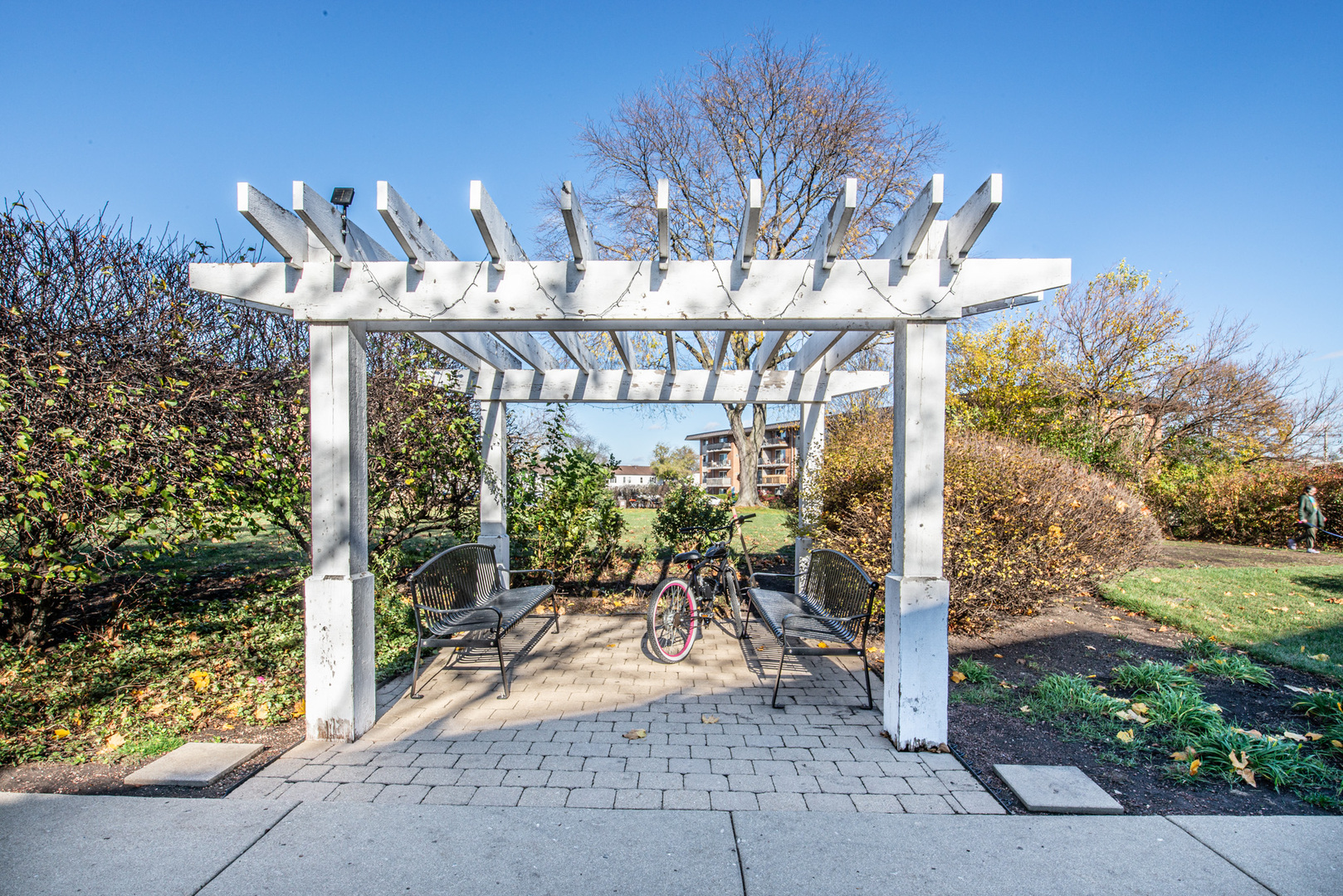 2234 South Goebbert Road, Unit 320 Arlington Heights, IL 60005 - Photo 32 of 37 a view of a patio with table and chairs and potted plants