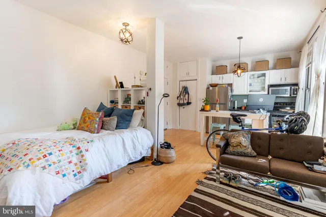 a bedroom with furniture and a chandelier