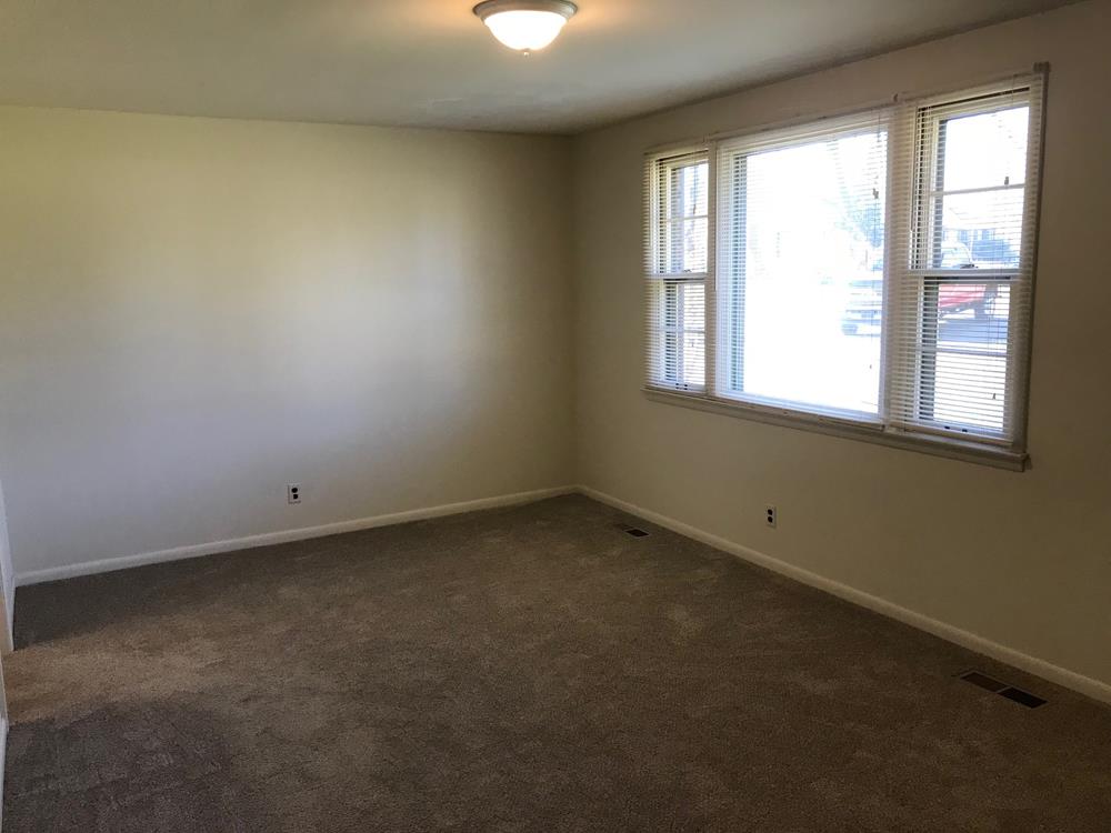 703 Olympia Place Murfreesboro, TN 37130 - Photo 6 of 13 an empty room with a window