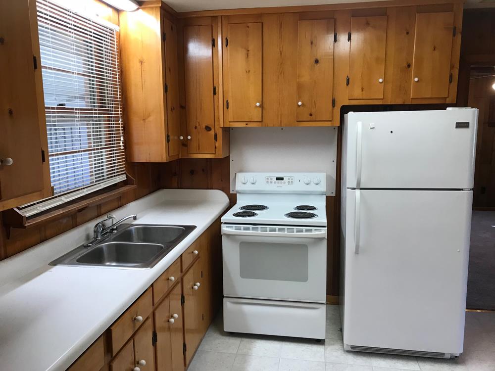 703 Olympia Place Murfreesboro, TN 37130 - Photo 8 of 13 a kitchen with a sink and a refrigerator