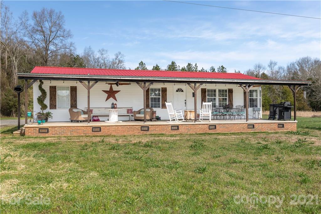 854 West Rambo Road Rock Hill, SC 29730 - Photo 1 of 27 a front view of a house with swimming pool and glass windows