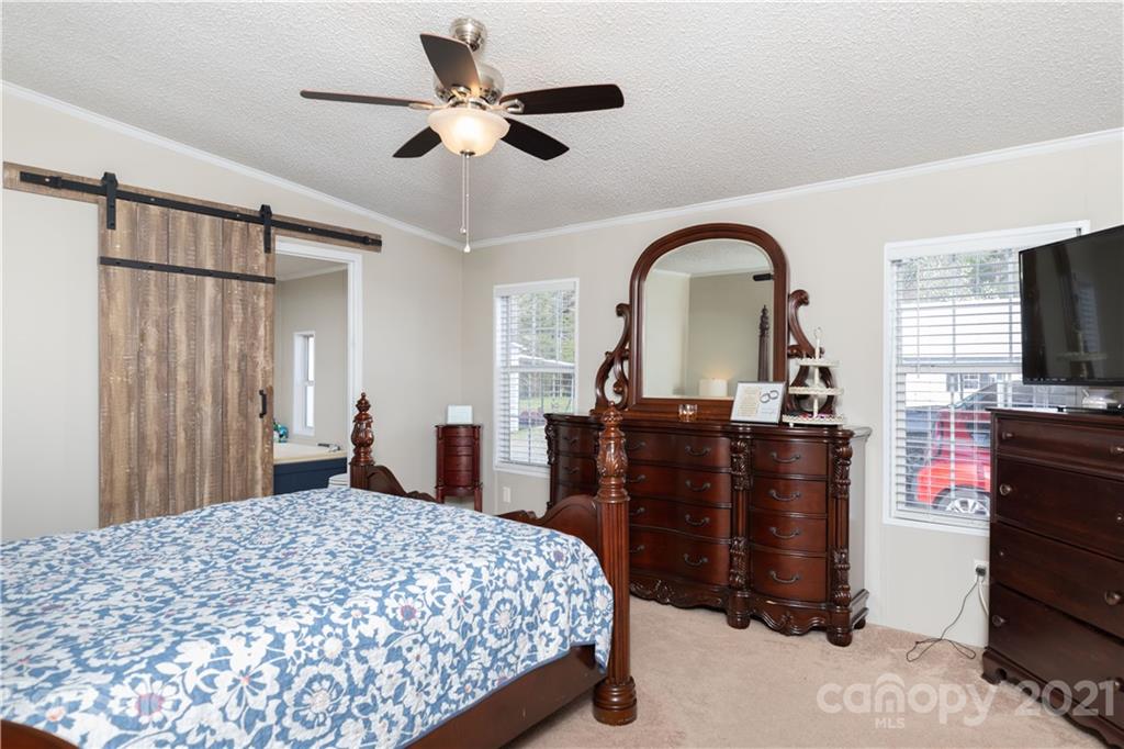 854 West Rambo Road Rock Hill, SC 29730 - Photo 17 of 27 a bedroom with a bed and a flat screen tv