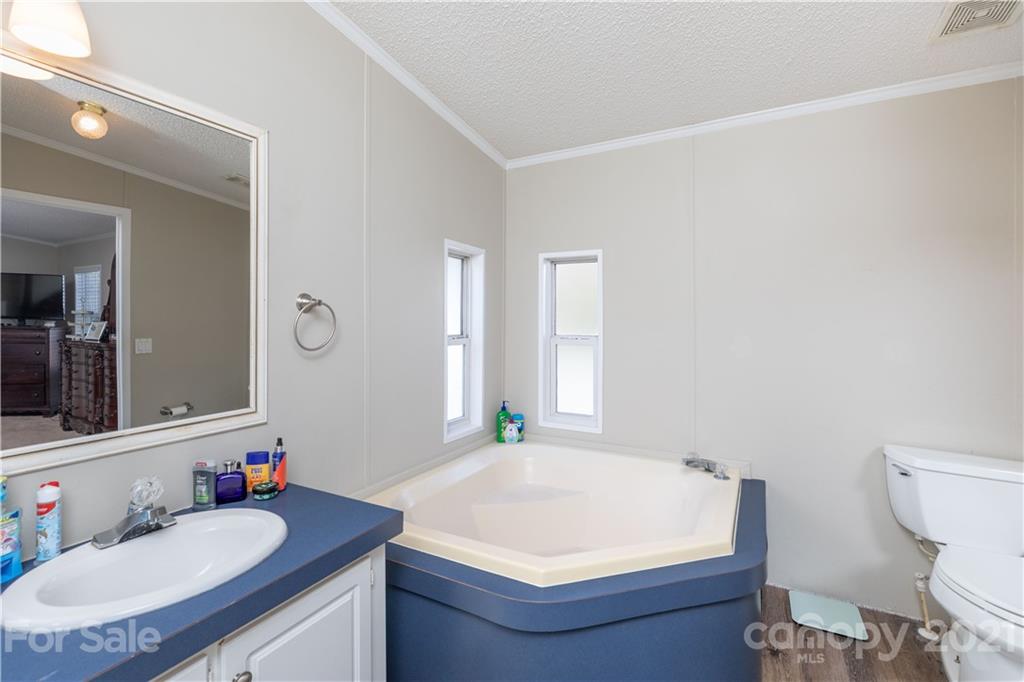 854 West Rambo Road Rock Hill, SC 29730 - Photo 20 of 27 a bathroom with a granite countertop sink and a mirror