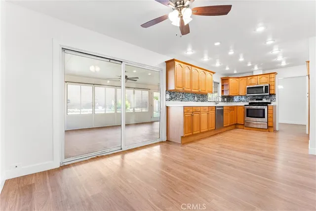 a view of kitchen with wooden floor