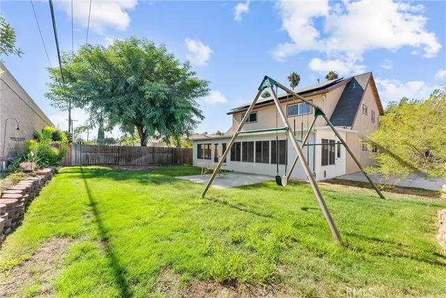 a house with swimming pool in the background