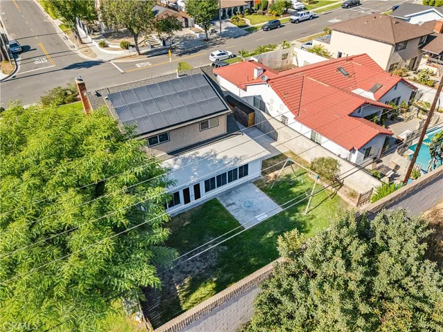 an aerial view of a house with a garden