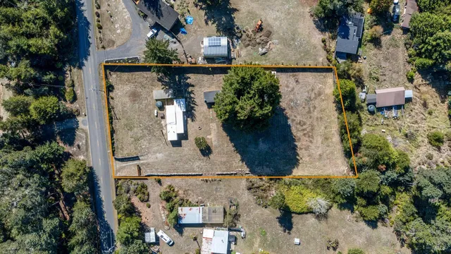 an aerial view of a house with outdoor space
