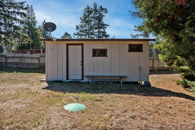a view of a backyard of the house