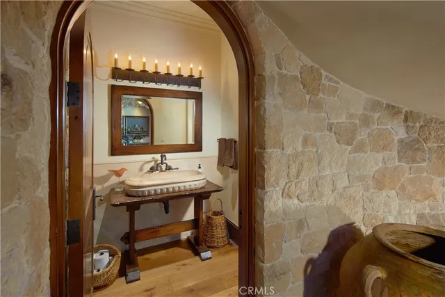 a bathroom with a sink a mirror and a shower