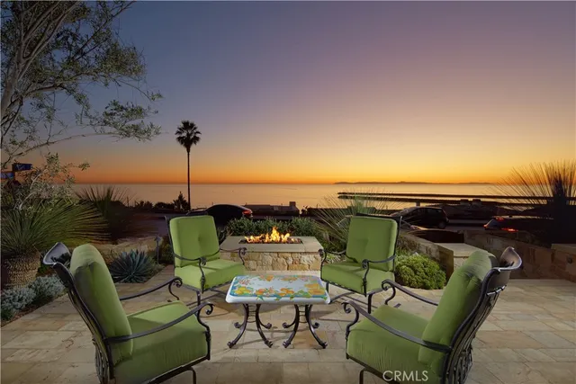 a view of a chairs and table in patio