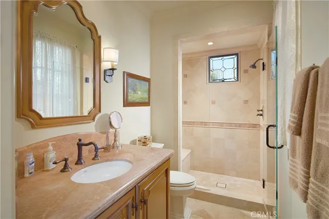 a bedroom with two beds and a window