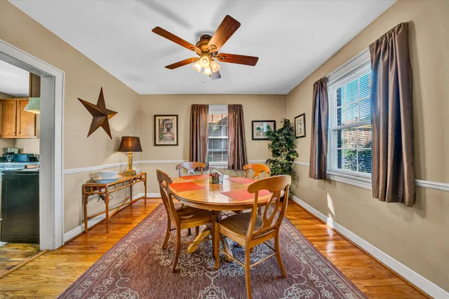 a bedroom with a bed and a flat tv screen on dresser