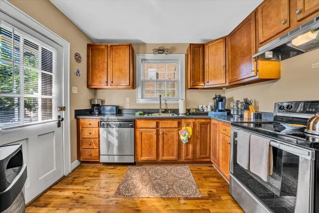 a bedroom with a bed and flat screen tv