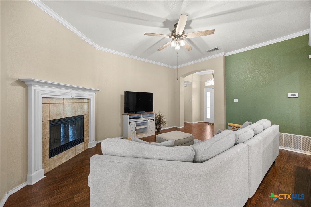 910 Neuberry Cliffe Temple, TX 76502 - Photo 7 of 32 a living room with furniture and a fireplace