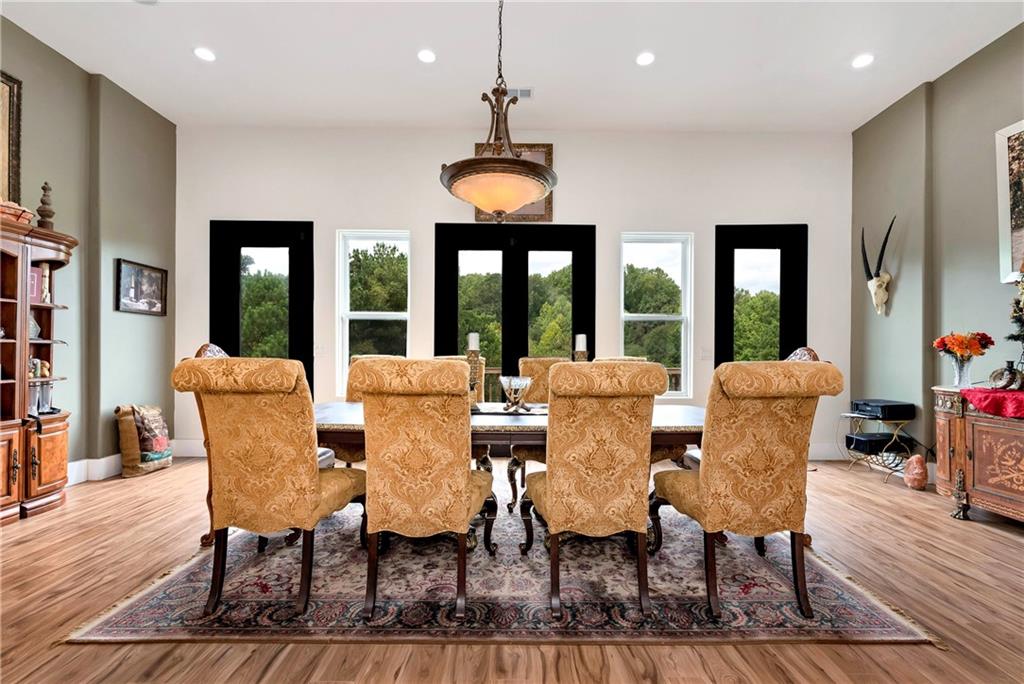 1197 Dee Kennedy Road Auburn, GA 30011 - Photo 14 of 78 a view of a dining room with furniture window and wooden floor