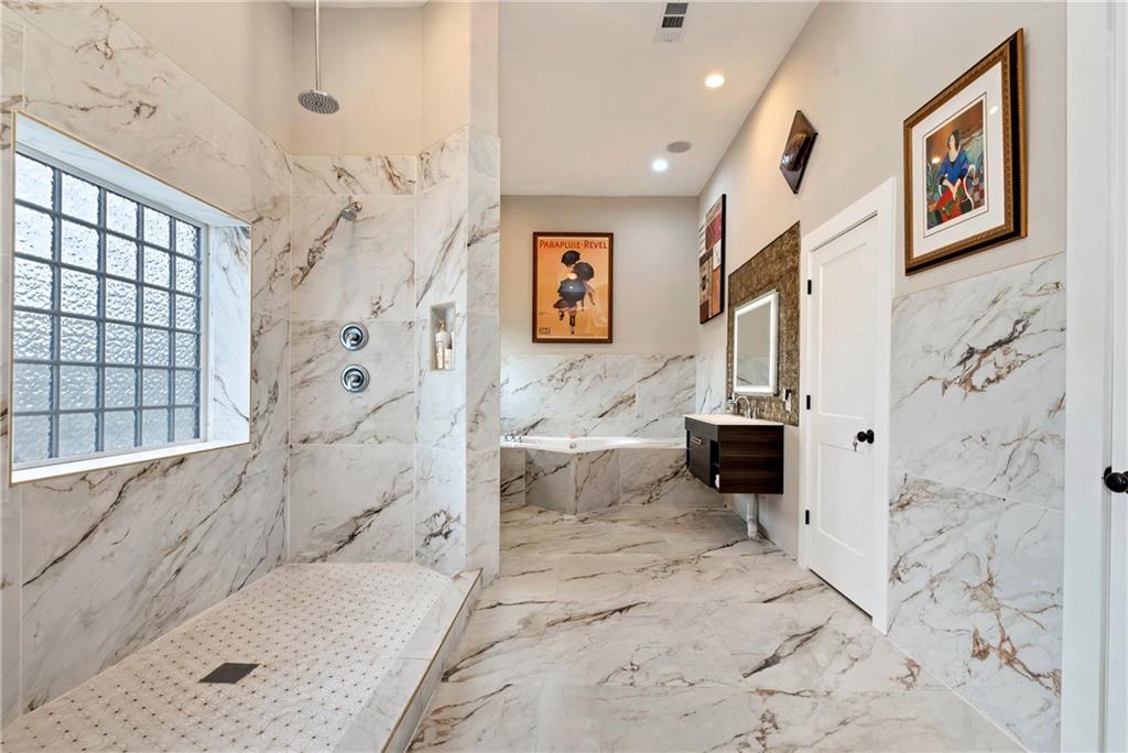 1197 Dee Kennedy Road Auburn, GA 30011 - Photo 21 of 78 a bath room with a bath tub and a shower