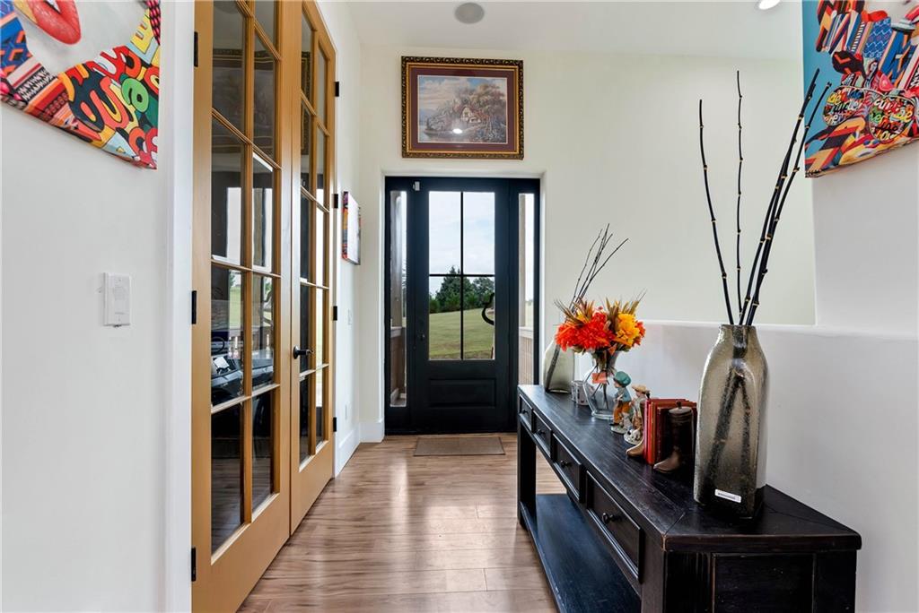 1197 Dee Kennedy Road Auburn, GA 30011 - Photo 24 of 78 a hallway with painting on the wall and a window
