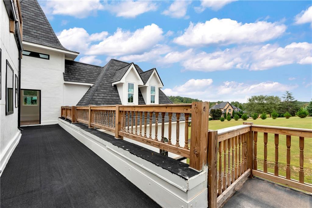 1197 Dee Kennedy Road Auburn, GA 30011 - Photo 28 of 78 a view of a balcony with wooden floor and fence