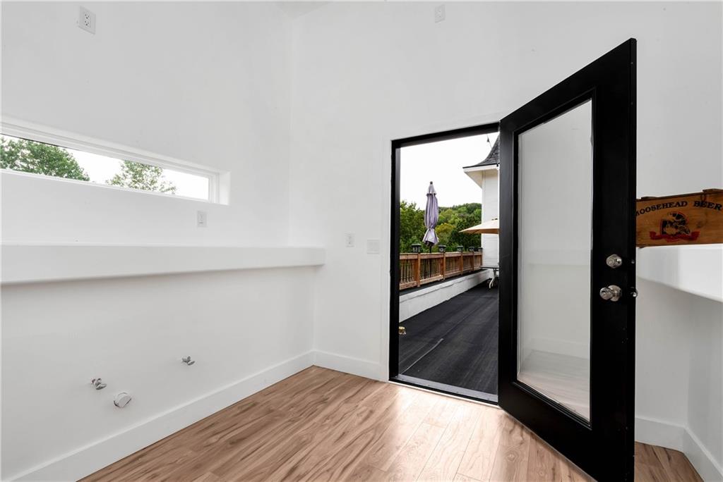 1197 Dee Kennedy Road Auburn, GA 30011 - Photo 29 of 78 a view of empty room with wooden floor
