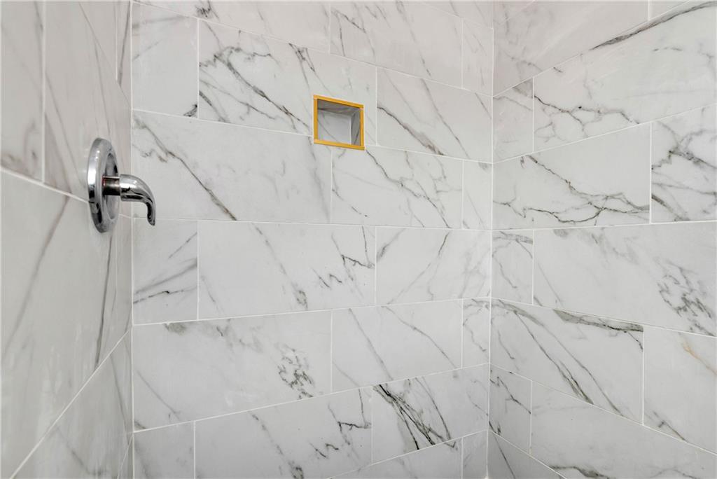 1197 Dee Kennedy Road Auburn, GA 30011 - Photo 39 of 78 a bathroom with a shower