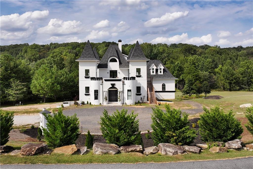 1197 Dee Kennedy Road Auburn, GA 30011 - Photo 4 of 78 a front view of a house with a yard